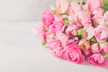 Ranunculus bouquet lying on a light table