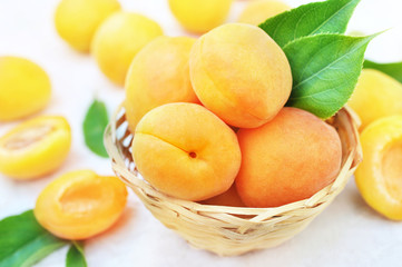 Basket of fresh ripe sweet apricots, selective focus, toned