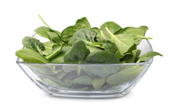 Glass bowl of fresh spinach