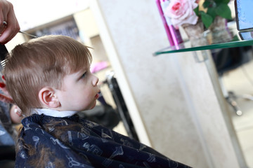 Kid at hairdresser