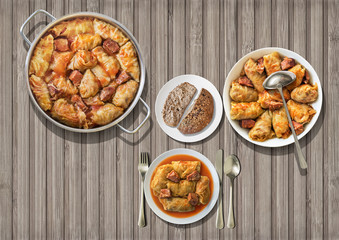 Gourmet Stuffed Pickled Cabbage Rolls Cooked With Pork Dry Cured Ham And Smoked Ribs Served With Integral Brown Bread On Wooden Rustic Slatted Place Mat
