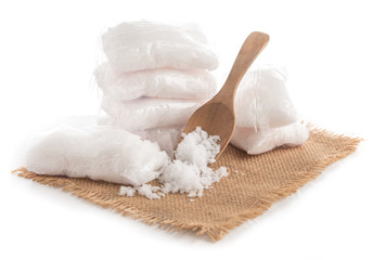 Salt in the plastic bag on white background