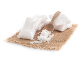 Salt in the plastic bag on white background