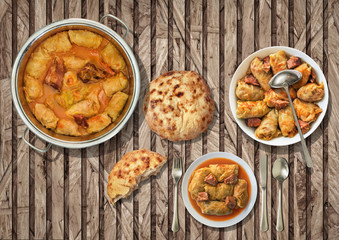 Stuffed Pickled Cabbage Rolls Cooked With Pork Dry Cured Ham And Smoked Ribs Served With Leavened Flatbread On Rustic Slatted Chipboard Place Mat