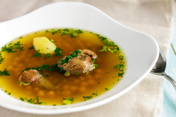 Soup piti with mutton and chickpeas, potatoes in a white plate. Petey