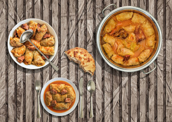 Stuffed Pickled Cabbage Rolls Cooked With Pork Dry Cured Ham And Smoked Ribs Served With Leavened Flatbread On Rustic Slatted Chipboard Place Mat