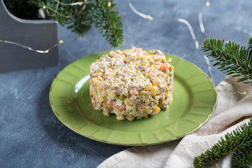 Traditional russian New Year salad , Olivier salad, on a plate.