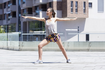 Young fitness female runner stretching body  before run