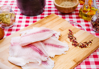 Fresh raw fillet of tilapia fish