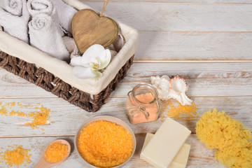 fruit bath salt with olive oil and gray natural soap next to the orchidwith place for text