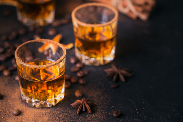 Whiskey, brandy or liquor, spices, anise stars, coffee beans, cinnamon sticks