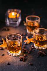 Whiskey, brandy or liquor, spices, anise stars, coffee beans, cinnamon sticks