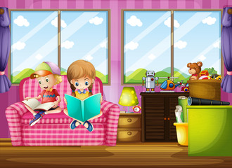 Boy and girl reading book on sofa