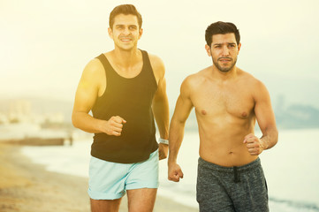 Adult men are jogging together