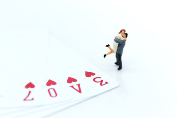 Miniature people: Couple hug each other to show love. Image use for Valentine's day concept.