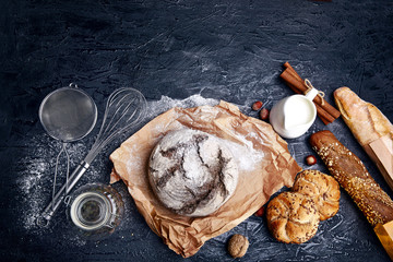 Fresh bread with crispy crust on parchment paper milk flour