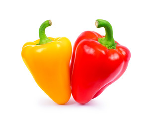 Yellow and red peppers closeup isolated on white background