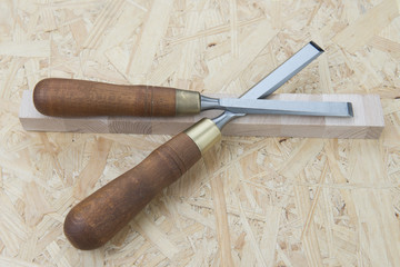professional chisels on a wooden background