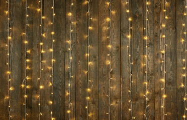 dark wood background with lights, abstract holiday backdrop, copy space for text