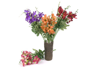 Multicolored flowers in a vase isolated on white background