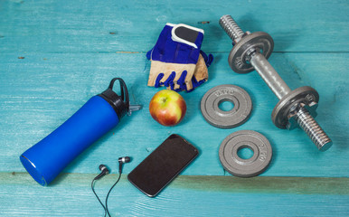 Sports accessories for fitness on the blue floor
