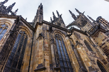 Fototapeta na wymiar Perspective view of Fragments of the facade of St. Vitus Cathedral in Prague, Czech Republic