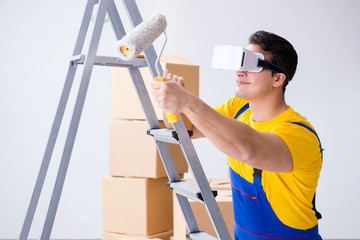 Painter contractor working with virtual reality goggles