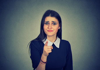 Upset woman pointing and blaming