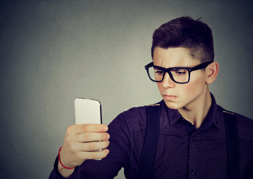 Serious Young Man Taking A Selfie