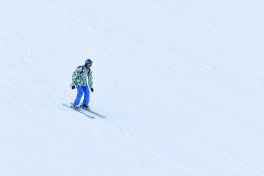 BUKOVEL, UKRAINE- 27 JANUARY 2018: Man skiing down the snow-covered slope