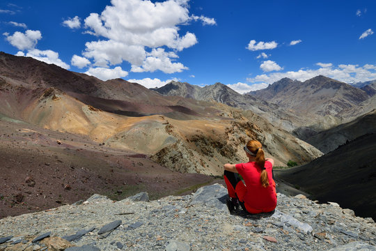 Traveller on the trekking on Markha valley trek route in Ladakh, Karakorum panorama. This region is a purpose of motorcycle expeditions organised by Indians