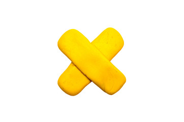 Yellow cross pointer isolated. Modelling clay navigation sign on white background.