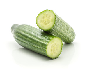 Sliced European cucumber (burpless, seedless, hothouse, gourmet, greenhouse or English) isolated on white background one cut in two halves.