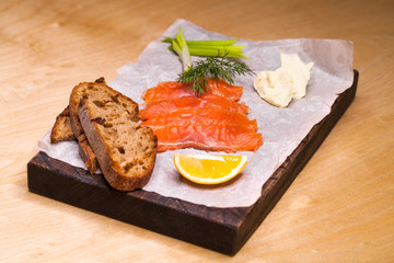 Fresh salmon sashimi salad on bamboo dish