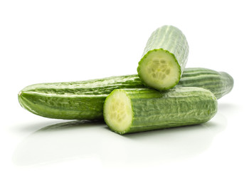 European cucumber (burpless, seedless, hothouse, gourmet, greenhouse or English) isolated on white background one whole and two fresh cut halves.