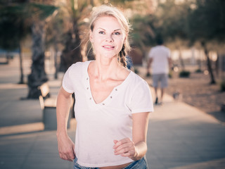 Sportswoman is jogging in the park