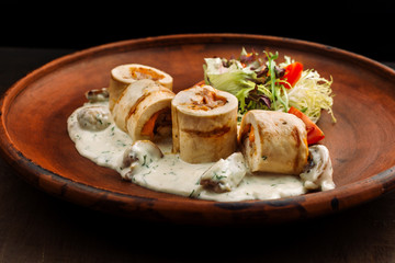 Chicken rolls with mushrooms.