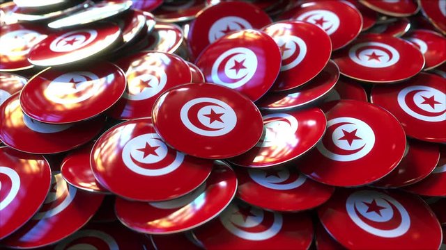 Pile of badges featuring flags of Tunisia