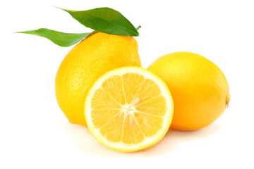 Naklejka na ściany i meble healthy food. lemon with green leaf isolated on white background