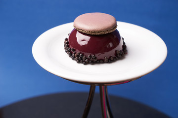 Three berries cake dessert with macarron