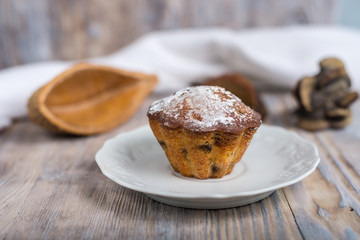 Sweet cupcake on wooden table