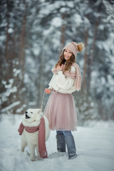 Beautiful woman with samoyed dog