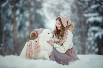 Beautiful woman with samoyed dog