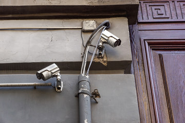 video camera security system on the wall of the building