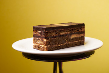 Opera cake slice on a white plate