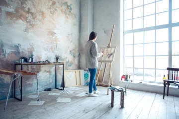 Fotobehang Young woman artist painting at home creative standing drawing © Viktoriia