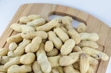 Peanuts on wood board