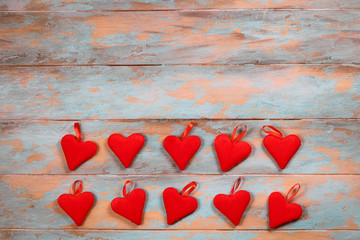Red hearts on wooden background. Top view with copy space