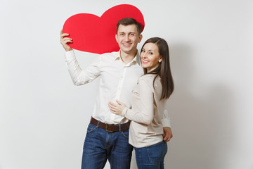 Couple in love. Man and woman with big red heart isolated on white background. Copy space for advertisement. With place for text. St. Valentine's Day International Women's Day birthday holiday concept