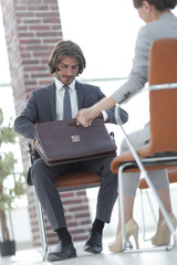 A relaxed conversation of a man and a woman in the office